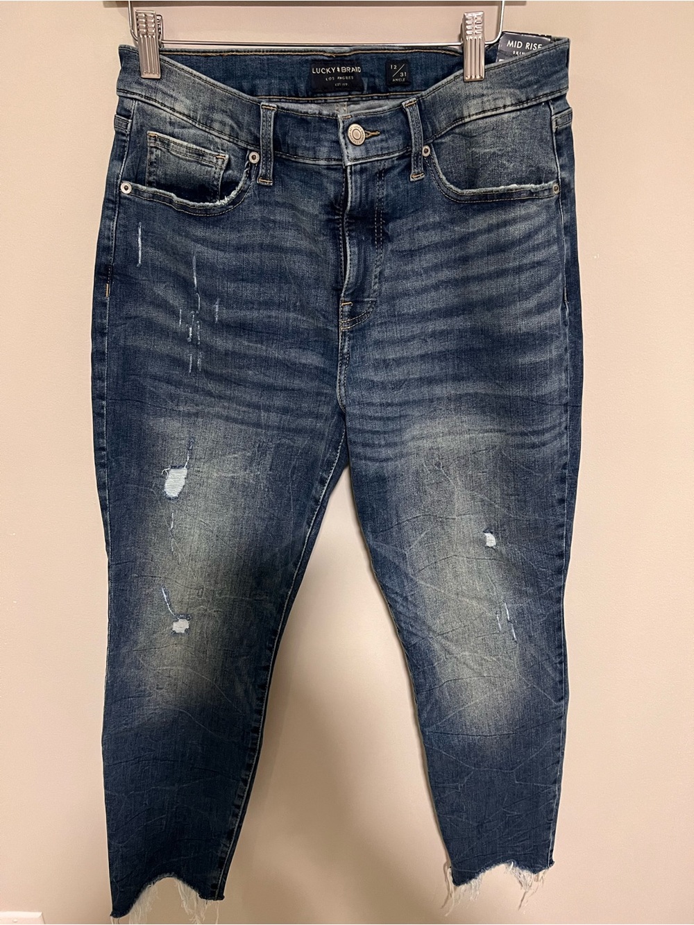 Lucky Brand women’s Dark Blue Skinny Jeans with Faded Distressing - size 12/31